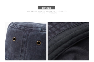 Close-up of vintage metal eyelets and reinforced double stitching on washed denim hat