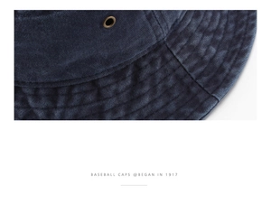 Detailed close-up of washed denim bucket hat with reinforced stitching and metal eyelets