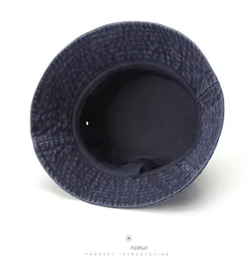 Detail view of navy blue washed cotton bucket hat showing inner lining and stitching