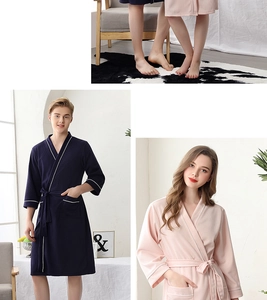 Detail of waffle weave texture and white striped trim on the navy blue and pink robes