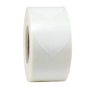 Detail view of a roll of white heart-shaped adhesive stickers on a clean white background