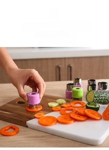 Detailed close-up of stainless steel vegetable cutters with ergonomic plastic handles