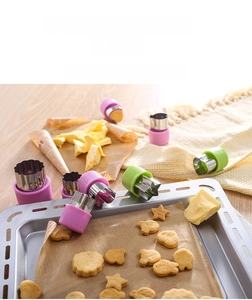 Detailed set of stainless steel vegetable cutters with colorful protective plastic grips