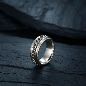 Men's titanium steel spinner chain ring for opening beer bottles on dark rock background