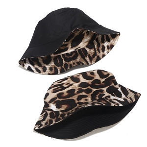 Reversible leopard print and solid black cotton bucket hat for outdoor sun protection