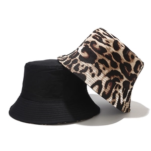 Detail of cotton bucket hats in leopard print and black with reinforced brim stitching