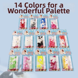 Detail showing 14 packs of colorful silicone pet nail caps for dogs and cats with glue