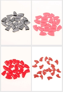 Detailed view of colorful soft silicone cat nail caps in grey, pink, red and rose colors