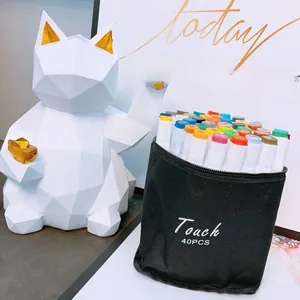 Detail of 40-color dual-tip marker set in a black canvas bag with white feline sculpture