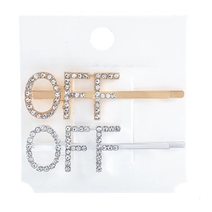 Detailed view of rhinestone inlaid OFF letter hair pins in gold and silver finish