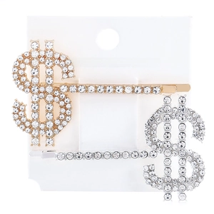 Close-up of gold and silver dollar sign hair clips with sparkling crystal rhinestones