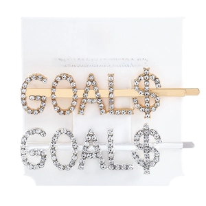 Macro detail of rhinestone GOALS letter hair clips in gold and silver finish set