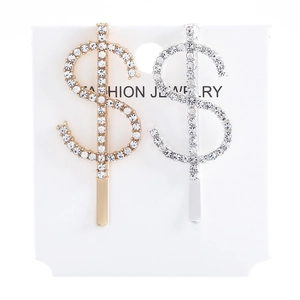 Detail showing gold and silver dollar sign hair clips with sparkling rhinestones set