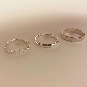 Minimalist 925 sterling silver ring set featuring rope, smooth, and textured band designs