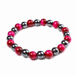 Detailed view of 12mm magnetic and tiger eye beads in red and dark grey on health bracelet