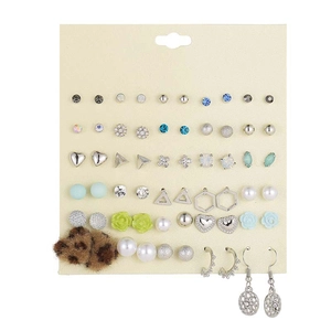 Detail view of 30 pairs of assorted stud earrings on a card featuring pearls and crystals