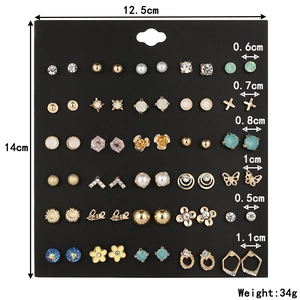 Detailed view of 30 pairs of assorted stud earrings on black card with precise measurements