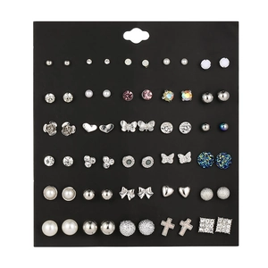 Flat lay of 30 pairs of colorful alloy stud earrings with pearls and rhinestones