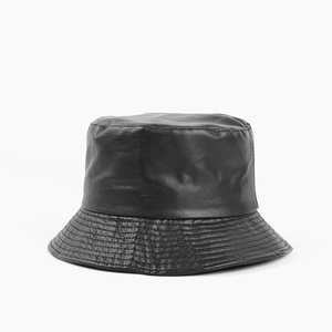 Close-up of black PU leather bucket hat with fine stitching detail on brim