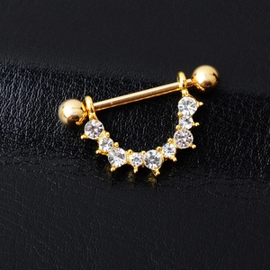 U-shaped gold nipple ring with sparkling crystal rhinestones on black leather background