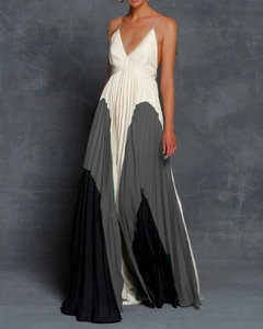 Detail view of the deep V-neckline and slim spaghetti straps on this pleated maxi dress