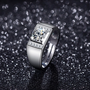Macro shot of men's square signet ring with large round solitaire and paved accents