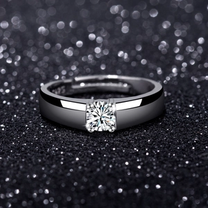 Macro shot of S925 sterling silver stamp and four-prong solitaire zircon engagement ring