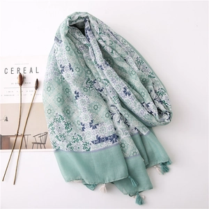 Elegant mint green linen scarf with bohemian floral print and stylish fringe tassels