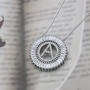 Silver plated letter A necklace with cubic zirconia pendant on open book