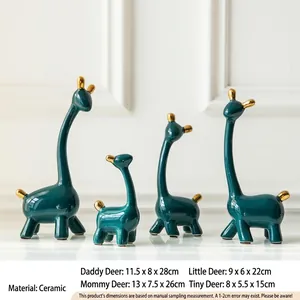 Detailansicht der dunkelgrünen Keramik-Giraffen mit eleganten handgemalten Goldakzenten