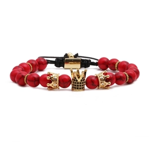 Red turquoise bead bracelet with golden crown accents and adjustable black woven cord