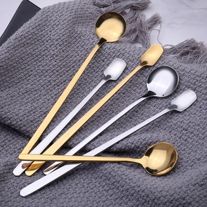 Long handle stainless steel ice cream spoons with round and square heads on a soft blanket