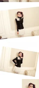 Detail of elegant black top with white lace collar and layered mesh tulle skirt set