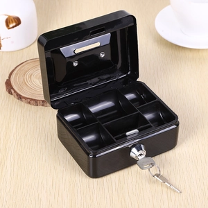 Mini black metal cash box with removable tray and key lock on wood surface