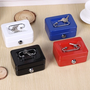 Mini metal money boxes in blue, red, white, and black with key locks on a wooden desk