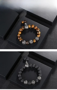 Detailed view of beaded bracelets with tiger eye stone, lava rock and engraved metal spacers