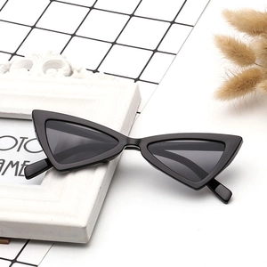Retro black triangle cat eye sunglasses with thick frames and dark lenses for fashion