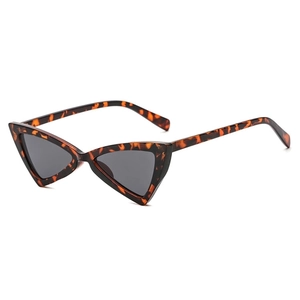 Chic cat eye sunglasses with triangular tortoiseshell frames and dark lenses at 45-degree angle