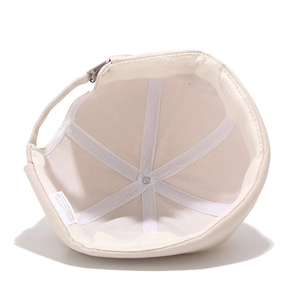 Beige cotton docker hat featuring internal structure detail and adjustable metal buckle