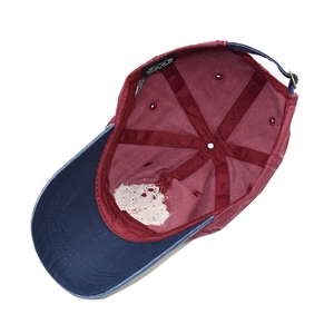 Detail view of cotton baseball cap interior featuring neat stitching and metal buckle
