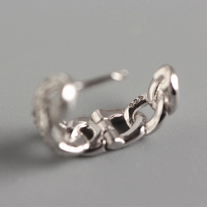 Macro shot of S925 sterling silver chain earrings showing the official hallmark stamp