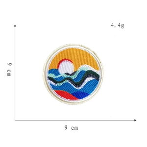 9cm circular embroidered patch featuring abstract mountain, sun, and wave landscape design