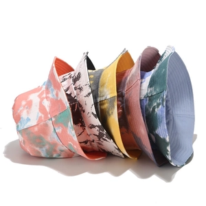 Five trendy tie-dye cotton bucket hats in various vibrant colors for men and women