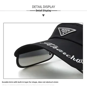 Detail of black sun visor with triangular rubber patch and white decorative letters