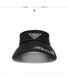 Macro detail of black sun visor featuring branded triangle logo and embroidered brim