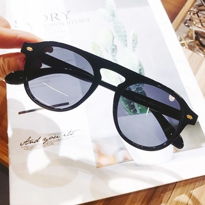 Close-up of black full-frame sunglasses showing temple details and size specifications