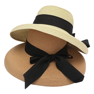 Women's summer straw sun hats in beige and khaki with black decorative ribbons