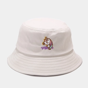 Close-up of colorful unicorn embroidery on a creamy white cotton bucket hat