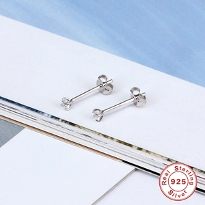 Detail of S925 sterling silver stud earrings with clear zircon in four-prong setting