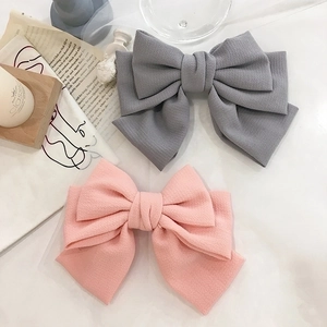 Elegant large bubble gauze layered bow hair clips in grey and pink with crepe texture